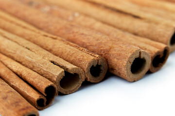 Cinnamon close up on a white background