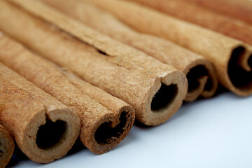 Cinnamon close up on a white background
