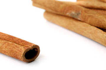 Cinnamon close up on a white background