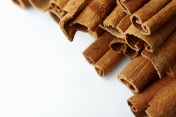 Cinnamon close up on a white background