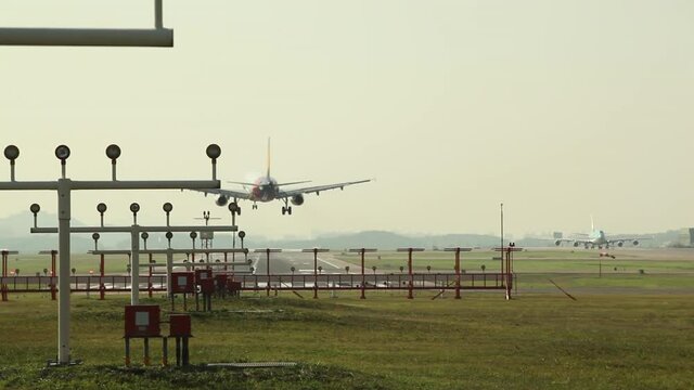 Korean Air passenger plane passing after landing of Asiana Airlines passenger plane