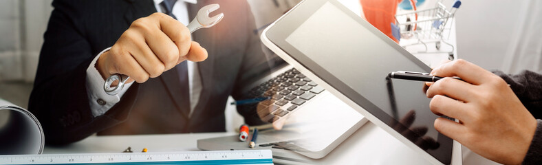 businesswoman hand using smart phone,mobile p payments online shopping,omni channel,digital tablet docking keyboard computer at office in sun light