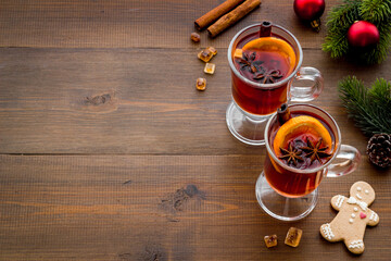 Christmas mulled wine - holiday background with fir branches and spices
