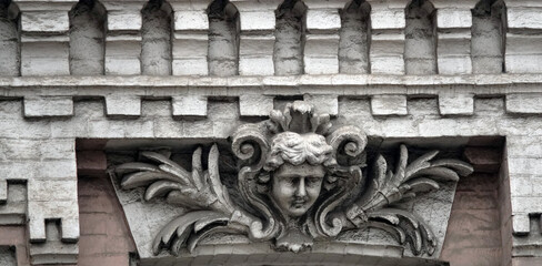 Building facade decor with human face
