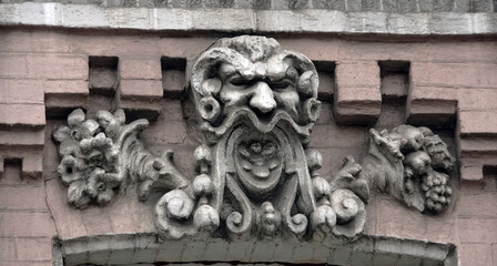 Building facade decor with human face