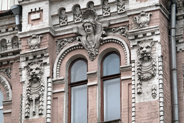 Fototapeta premium Building facade decor with human face