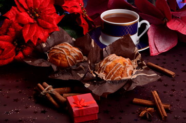 Two cakes on paper and coffee mug on a christmas background