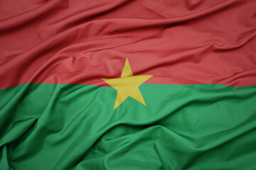 waving colorful national flag of burkina faso.