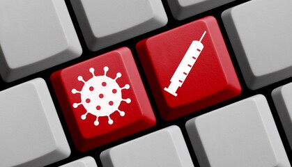 Impfstoff und Coronavirus Symbol auf Tastatur