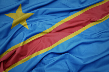 waving colorful national flag of democratic republic of the congo.