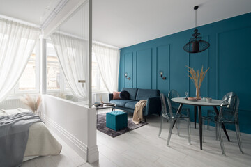 Living room with teal blue wall