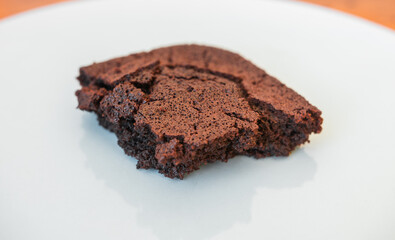 Delicious piece of brownie or chocolate cake in a plate. Professional food photography