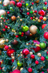 Beautiful Christmas background. Christmas tree decorated with toys, lights and tinsel.