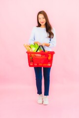 Fototapeta na wymiar Portrait beautiful young asian woman with fruit vegetable and grocery in basket