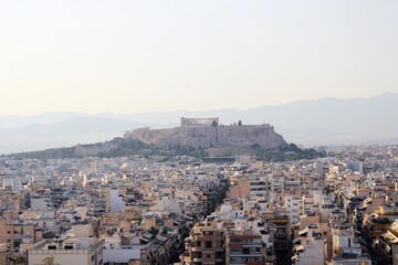 Fototapeta premium Partial view of Athens city with Acropolis hill in the background - Athens, Greece, June 13 2019.