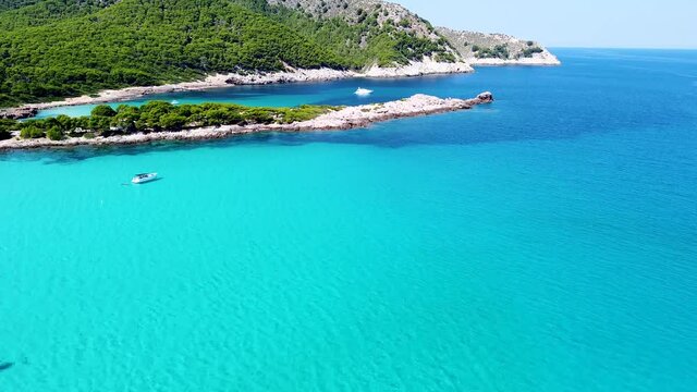 Aerial drone video of blue turquoise beach in Mallorca Spain.