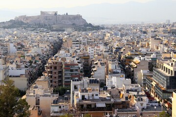 Partial view of Athens city with Acropolis hill in the background - Athens, Greece, June 13 2019.