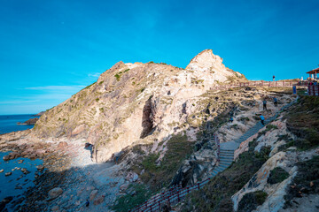 Rocks in the blue sea of Eo Gio cape, Binh Dinh province, Vietnam.