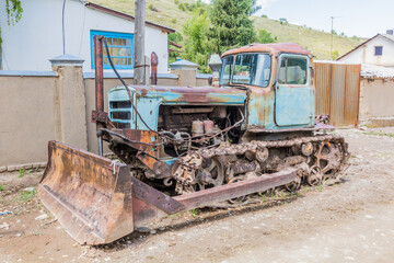 Old rusty bulldozer in Ak Suu village near Karakol in Kyrgyzstan © Matyas Rehak