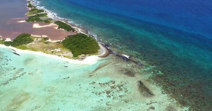 Los roques Venezuela.  Aerial view, pan rigth over coral reef canquices island.