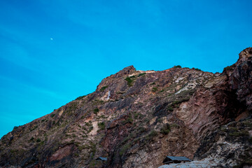 Rocks in the blue sea of Eo Gio cape, Binh Dinh province, Vietnam.