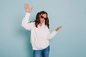 Indoor studio portrait of charming attractive people with collected hair wearing white sweater...
