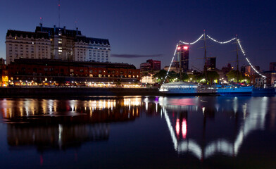 Fototapeta premium Tourism in Buenos Aires. Puerto Madero at night. The most modern and luxurious neighborhood in Buenos Aires shows all its glamor at night. 