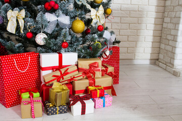 Fototapeta na wymiar Gift boxes under the Christmas tree copy space, New year and christmas concept