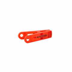 Red plastic clothespin isolated on a white background
