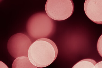 Pink bokeh is used as a background in Christmas. Valentine, New Year and other festivals