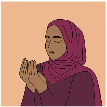 Muslim woman makes traditional prayer to God, keeps hands in praying gesture, wears traditional clothes in nijab, has serious facial expression, isolated over beige background
