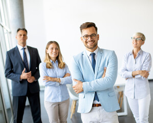 Group of a businesspeople standing together in the office