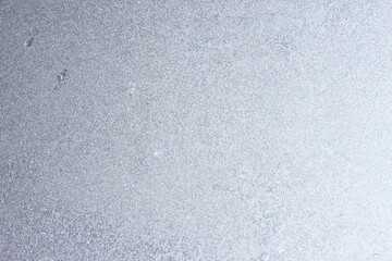 Graceful expressive winter natural background, macro texture. Copy space. Frosty pattern on winter window glass