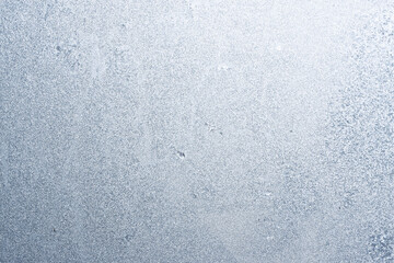 Graceful expressive winter natural background, macro texture. Copy space. Frosty pattern on winter window glass