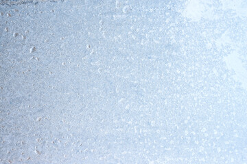 Graceful expressive winter natural background, macro texture. Copy space. Frosty pattern on winter window glass
