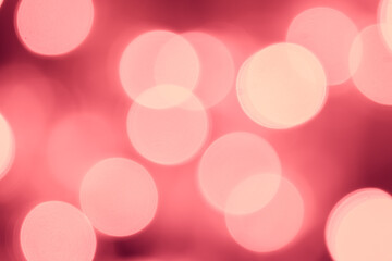 Pink bokeh is used as a background in Christmas. Valentine, New Year and other festivals