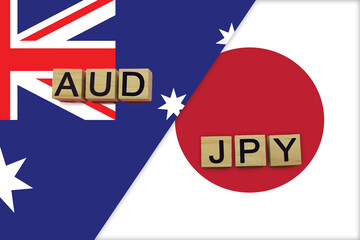 Australia and Japan currencies codes on national flags background