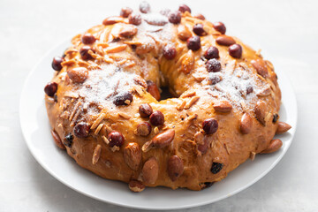typical portuguese fruit cake Bolo rainha on white dish