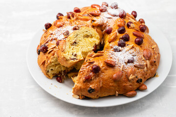 typical portuguese fruit cake Bolo rainha on white dish