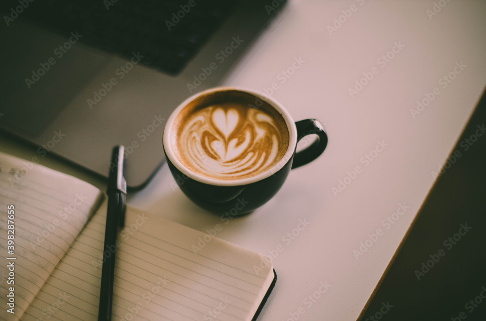 Wall mural cup of coffee and notebook