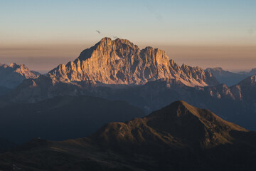 Beautiful scenic views of rocks and shadows at sunset in the Dolomites. Gorgeous stunning mountains in the golden hour. Italy