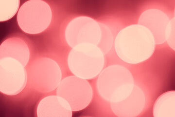 Pink bokeh is used as a background in Christmas. Valentine, New Year and other festivals