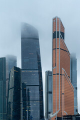 Moscow, Russia, November 30, 2020, Moscow international business center (Moscow city), night photography with long exposure, selective focusing, glare of night lights, foggy rainy weather