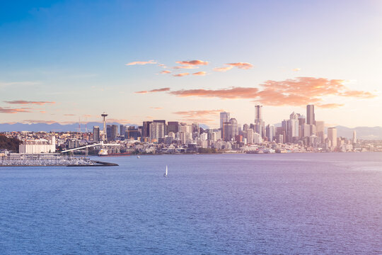 Downtown Seattle, Washington, United States of America. View of the Modern City on the Pacific Ocean Coast. Dramatic Sunset Sky Art Render.