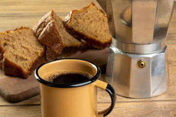 a few slices of banana cake with a cup of coffee