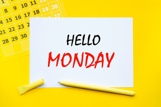 HELLO MONDAY. Abstract calendar yellow collour on a yellow background , Business concept written on notepad. Business and financial conzept.