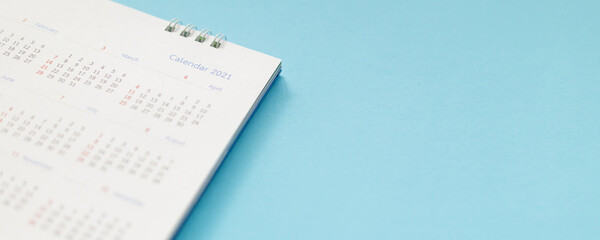 Fototapeta premium 2021 calendar page on blue background business planning appointment meeting concept