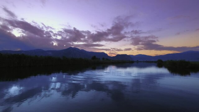 Dalyan,Mugla.Turkey.
Dalyan River, Dalyan Delta Channel. Sunrise. Shooting on the river between the reeds. reflection of clouds hits the water. gorgeous view. 4K.