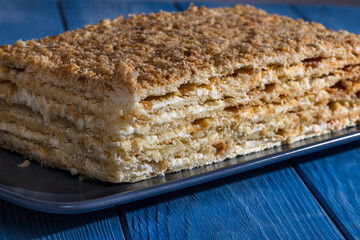 Layered cake with cream napoleon selective focus photo.