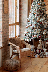 Christmas tree decorated with balls and wooden toys in eco-style. Warm brown tones.